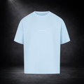 Hellblaues Oversized T-Shirt Vorderseite mit kleinem „Football Only“ Schriftzug, freigestelltes Produktbild auf dunklem Studio-Hintergrund, minimalistisches Premium Streetwear Design